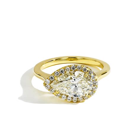 East West Pear Shaped Diamond Halo Engagement Ring In Yellow Gold