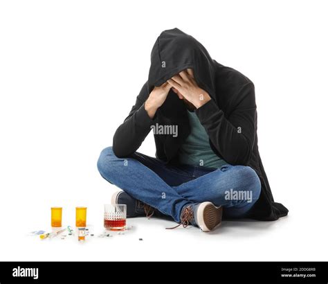 Male Junkie With Drugs And Alcohol On White Background Concept Of