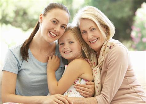 Grandmother With Daughter And Granddaughter Laughing Together On Sofa Stock Image Image Of