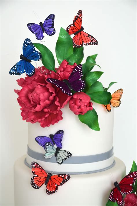 Detail Of Butterfly Themed Wedding Cake Decorated With Sugar Flowers