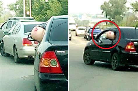 Woman Sticks Bottom Out Of Car Window On Busy Road To Flash Passers By