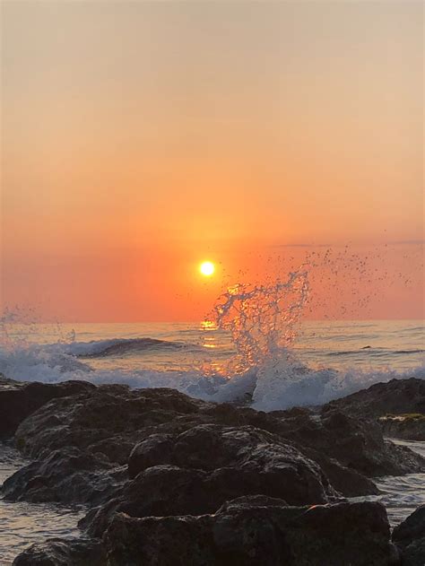 Ocean Waves Crashing On Rocks During Sunset · Free Stock Photo