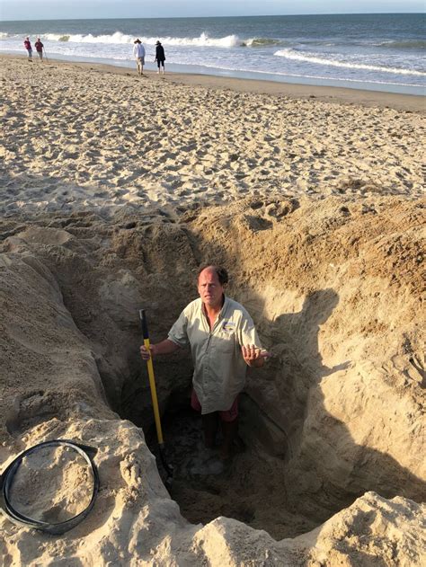 why north carolina beach safety officials don t want you to dig deep holes in the sand wfae 90