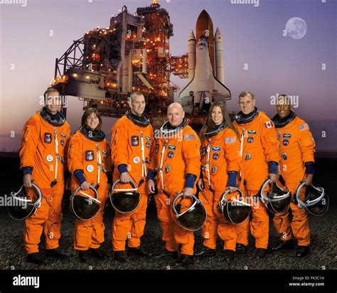 Group Portrait Of The Sts 118 Space Shuttle Crew Astronauts In Orange