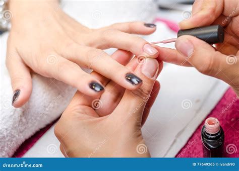 woman applying pink nail polish stock image image of beauty brush 77649265