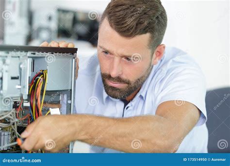 Repairman Working In Technical Support Fixing Computer Laptop Stock