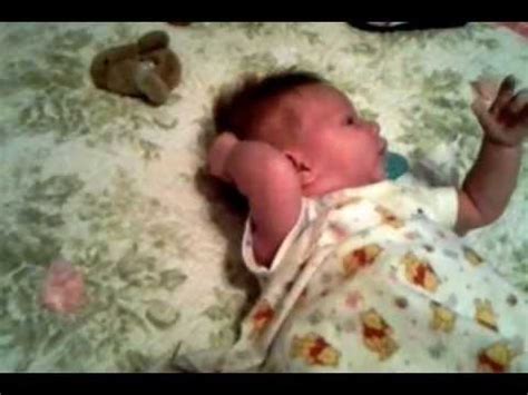 1‑curious 2‑determined 3‑patient 4‑athletic 5‑daring. Two week old baby pulls her own hair - YouTube