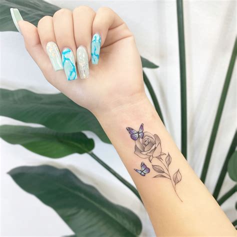 Roseandbutterflies Tattoo🌹💙🦋 Rose Tattoos On Wrist Tattoos For Women Flowers Butterfly Tattoos
