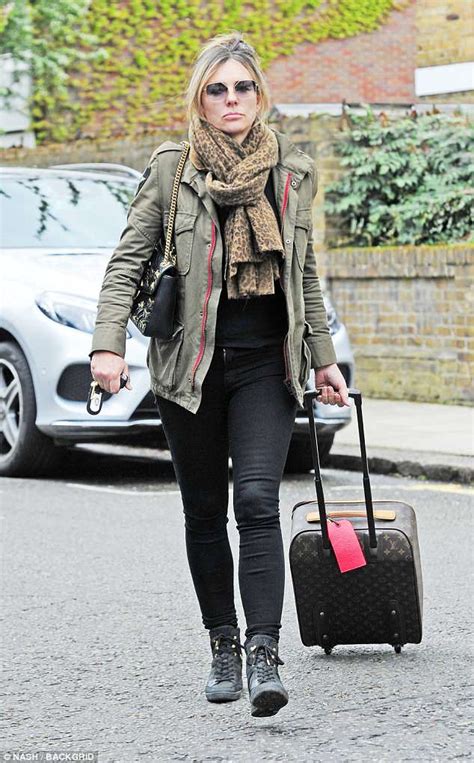 Elizabeth Hurley Goes Make Up Free As She Returns Home From Ibiza