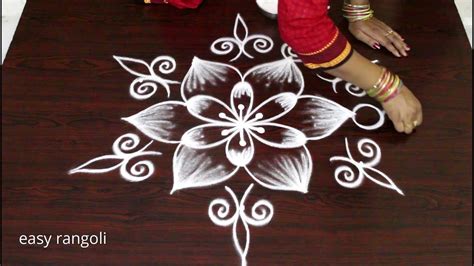 Take inspiration simple rangoli kolam designs so that you can also make it at home with your favourite peacock rangoli and rangoli kolam with colours. beautiful flower kolam with 5 dots * easy & Simple rangoli ...