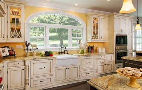 French country kitchens are cool, colorful and very fashionable. Whitewashing Kitchen Cupboards | Cottage Kitchen Bathed in ...