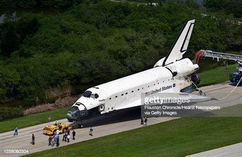 The Space Shuttle Atlantis Is Towed From The Landing Strip To The Opf