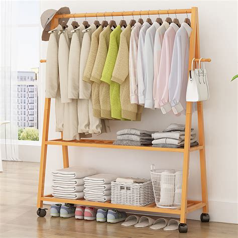 £75 ($97) at garden trading. Wood Clothes Rack on Wheels Rolling Garment Rack with 2 ...