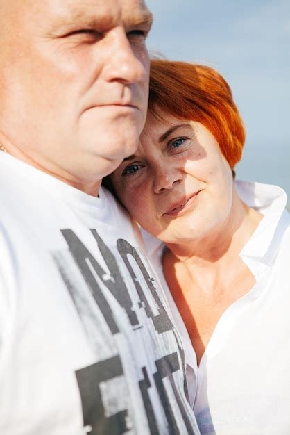 premium photo happy mature couple pose on sunny day on the beach