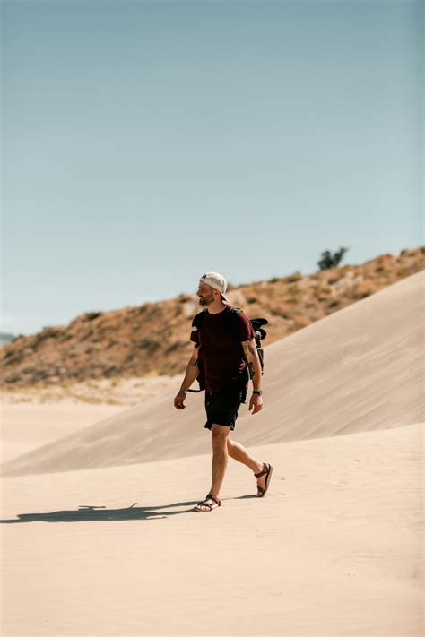 Man Standing On Desert Photo Free Nature Image On Unsplash