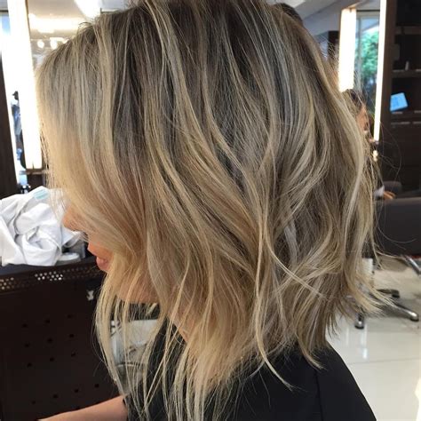 Long Shaggy Angled Bob With Tousled Waves The Latest Hairstyles For