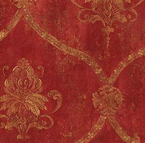 An Old Red And Gold Wallpaper With Ornate Designs On Its Edges