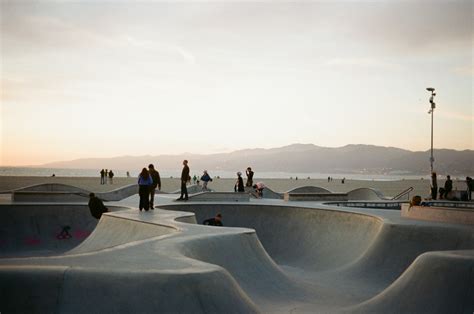 A Group Of People Standing Around A Skate Park Photo Free United