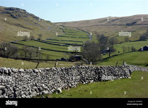 Dry Stone Wall Made Of Limestone And Fields From The Footpath Above