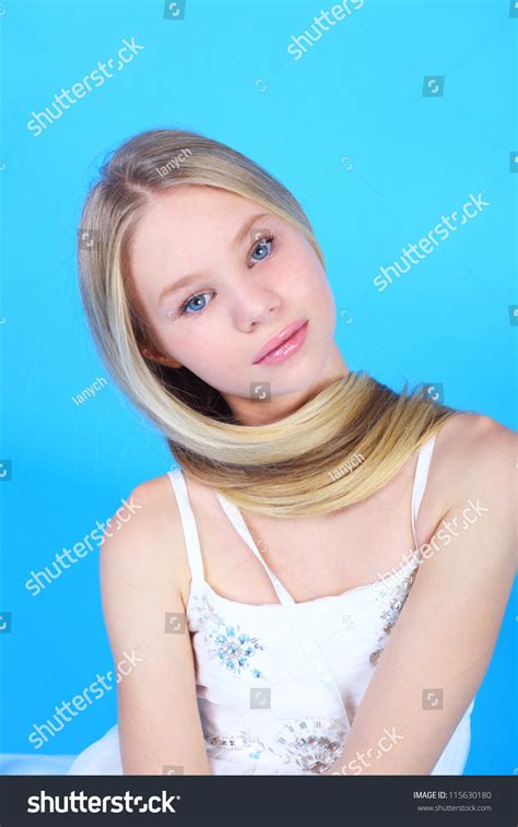 Showy Blond Teen Girl On Blue Shutterstock