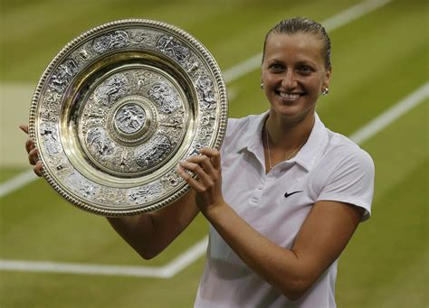Kvitova Of The Czech Republic Holds The Winner S Trophy After Defeating Bouchard Of Canada In