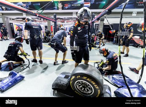 Formula One F1 Red Bull Pit Crew Working On The Garage During Pit Stop