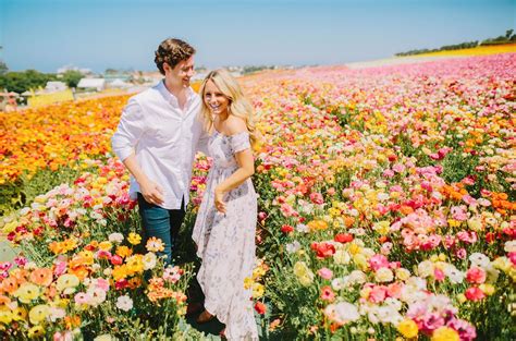 This Couple Captured Their Engagement Photos In A Flower Field Of Ranunculus Engagement