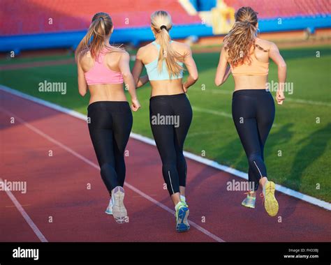 Athlete Woman Group Running On Athletics Race Track Stock Photo Alamy