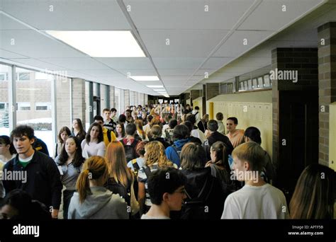 Crowds Of High School Students Fill Hallways During The Exchanging Of