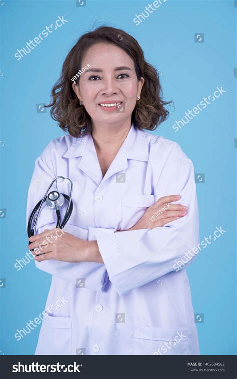 Asian Beautiful Pretty Mid Age Female Doctor In White Coat Blouse On