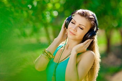 Beautiful Young Woman Listen To Music Wearing Headphones Outdoor Stock