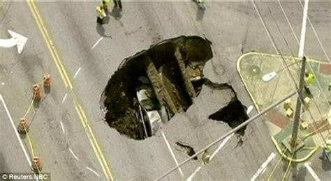 Toledo Sinkhole Driver In Ohio Rescued By Ladder After Her Car Was