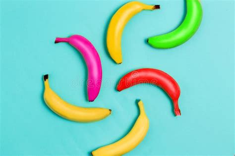 Colorful Fruit Pattern Of Fresh Yellow Bananas On Pink And Pastel Blue