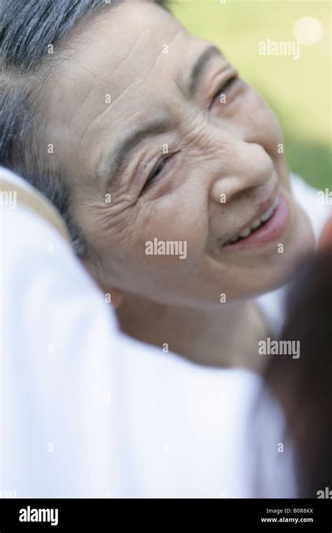 Person Bending Over Senior Woman Outdoors Close Up Stock Photo Alamy