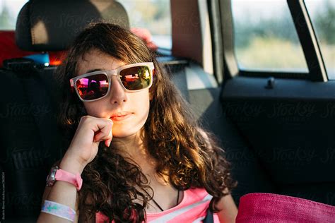 Girl In Sunglasses Looking At Camera In The Car By Stocksy