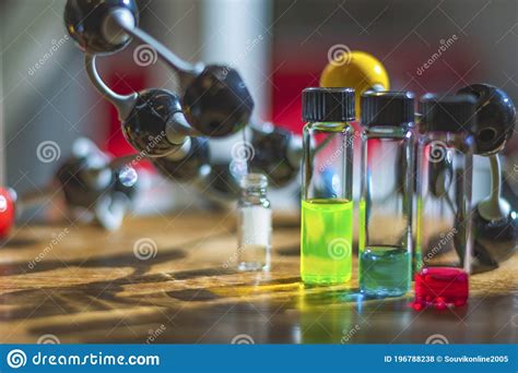 Chemical Solutions In Different Glass Vials Under The Light With