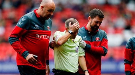 Referee Knocked Out And Helped Off Charlton Pitch After Collision With Player During Doncaster