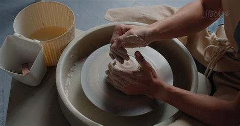 Crop Potter Wetting Clay On Turning Wheel Del Colaborador De Stocksy Danil Nevsky Stocksy