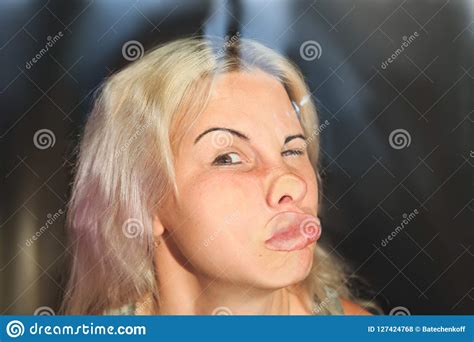 Female Face Pressed Against Glass Or Window Stock Photo