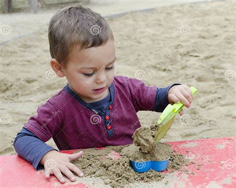 Child Playing In Sandpit Stock Photo Image Of Playground 34974660