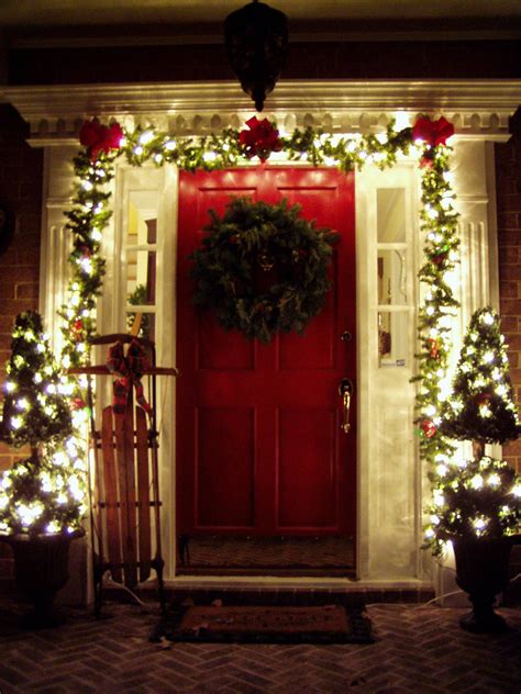 Outdoor christmas decorating ideas always include greenery and red bows. Decorating the Front Porch for Christmas, 2008