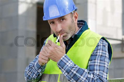 Builder Smoking Cigarette On Construction Site Stock Image Colourbox