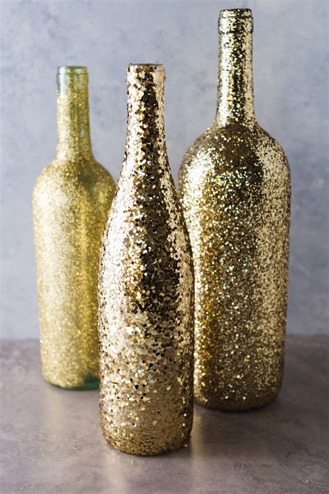 Make perfect favors for your party and new year celebrations with these glittery mini champagne bottles. DIY Wine Bottle Glitter Vases - A Little Craft In Your Day