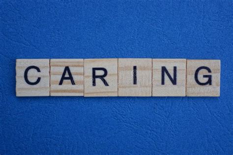 Gray Word Caring From Small Wooden Letters Stock Photo Image Of Block