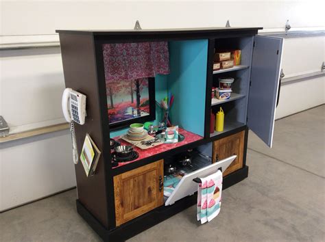 Via playtivities create a chalk table for kids to play. repurposed tv entertainment center / child's play kitchen ...