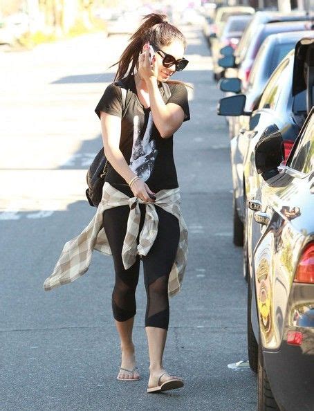 Vanessa Hudgens Tries To Hide Behind Her Phone And Trees As She Leaves A Gym After A Workout In
