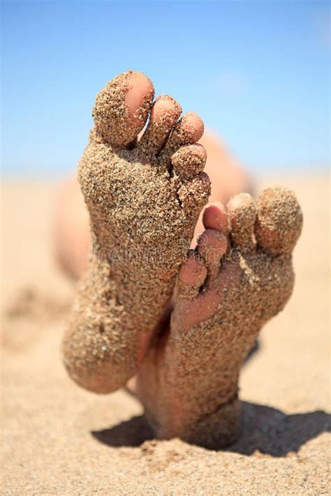 Photo About Bottom Of Male Feet Covered With Sand On The Beach In