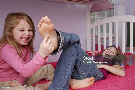 Does This Tickle Stock Photo Download Image Now Tickling Girls 4