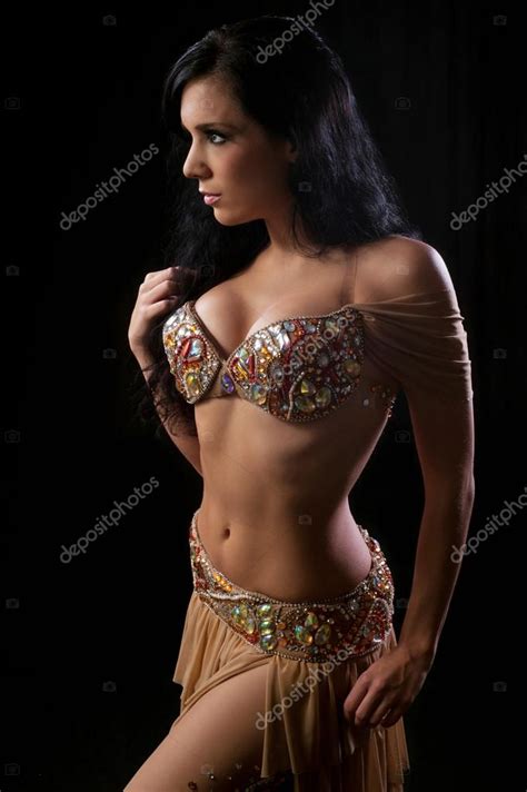 Brunette Belly Dancer Wearing A Beige Nude Colored Costume Stock
