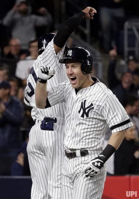 New York Yankees Batter Todd Frazier Reacts With Runner Aaron Hicks Rear As He Crosses Home